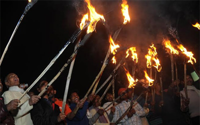 Torch light procession by RMC workers
